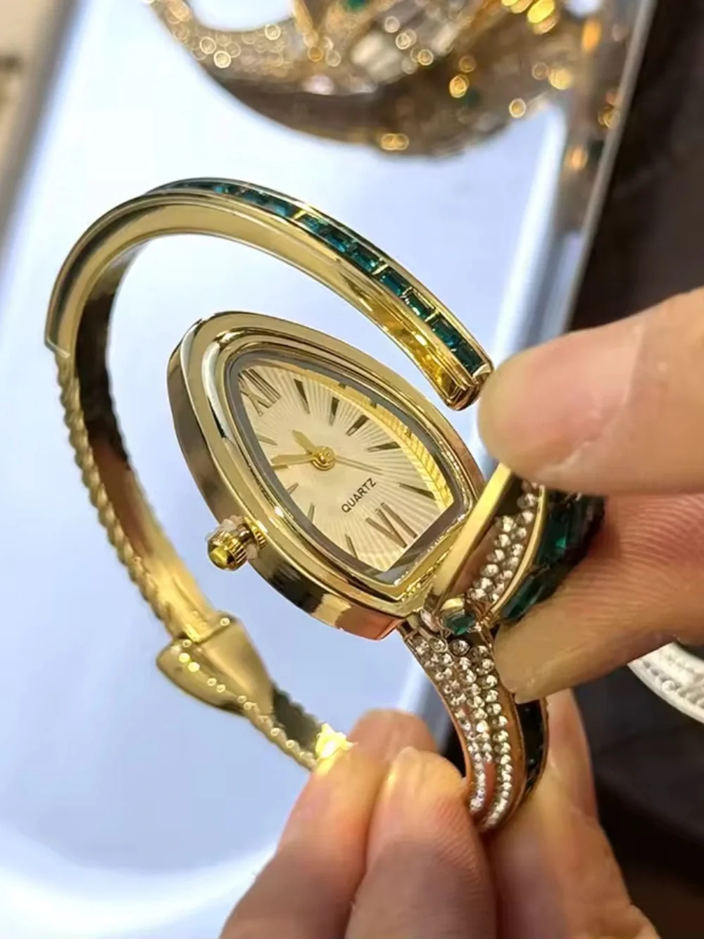 Macy's Gold Tone Bracelet Watch with Red and Green Stones